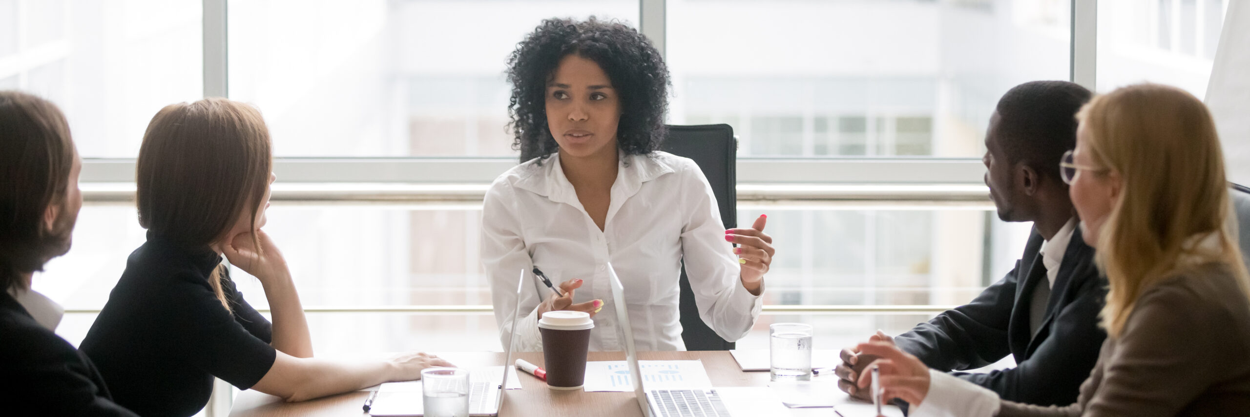 Horizontal,Photo,People,Sitting,At,Boardroom,African,Business,Woman,Talking