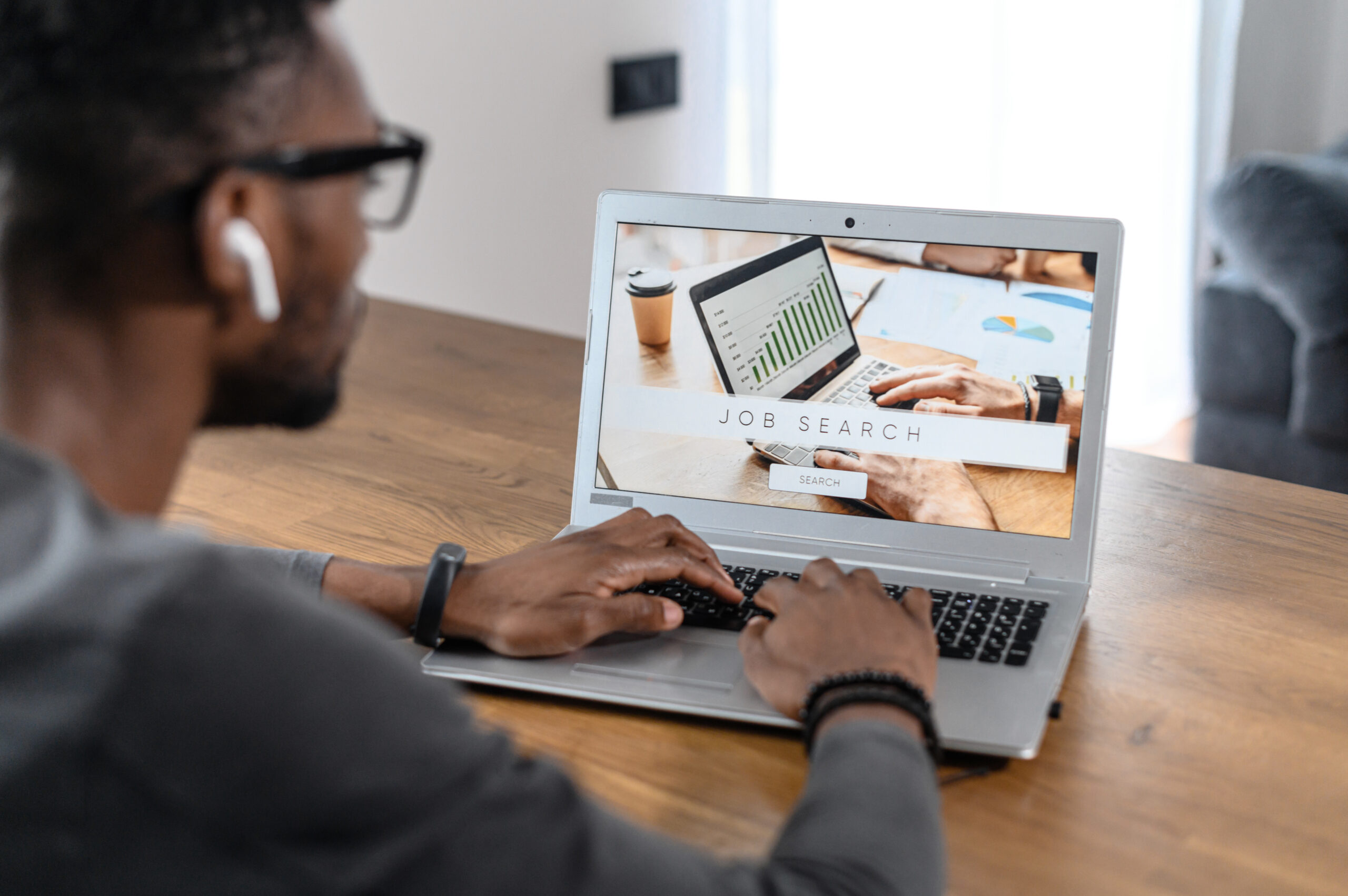 Back,View,Laptop,Screen,With,A,Page,With,Job,Search